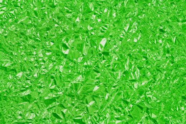 Yeşil kireç folyo parlak doku, arkaplan ve tasarım çalışmaları için soyut ambalaj kağıdı.