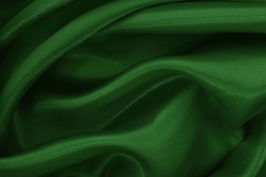 Arkaplan ve tasarım için koyu yeşil kumaş dokusu, güzel buruşmuş ipek ya da keten deseni..