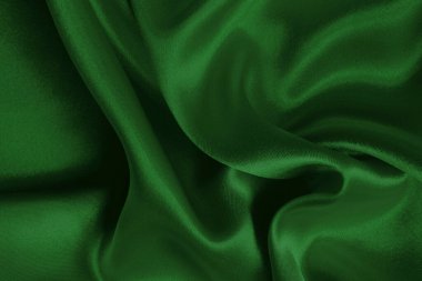 Arkaplan ve tasarım için koyu yeşil kumaş dokusu, güzel buruşmuş ipek ya da keten deseni..