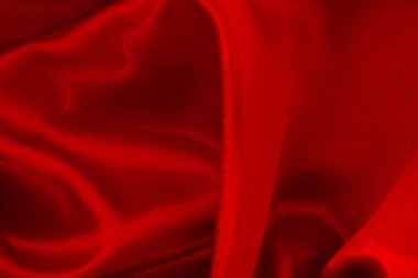 Arka plan ve tasarım için kırmızı kumaş dokusu, güzel buruşmuş ipek ya da keten deseni.