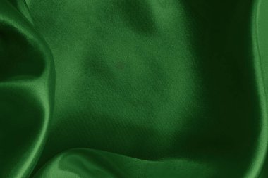 Arkaplan ve tasarım için koyu yeşil kumaş dokusu, güzel buruşmuş ipek ya da keten deseni..