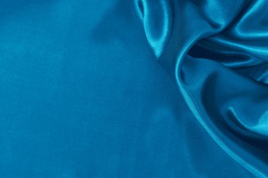 Arka plan ve tasarım için mavi kumaş dokusu, güzel buruşuk ipek ya da keten deseni.