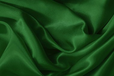 Arkaplan ve tasarım için koyu yeşil kumaş dokusu, güzel buruşmuş ipek ya da keten deseni..