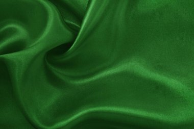 Arkaplan ve tasarım için koyu yeşil kumaş dokusu, güzel buruşmuş ipek ya da keten deseni..