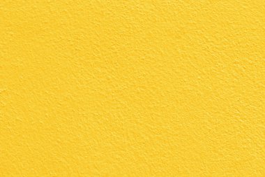 Arkaplan ve tasarım sanatı için sarı beton duvar dokusu.