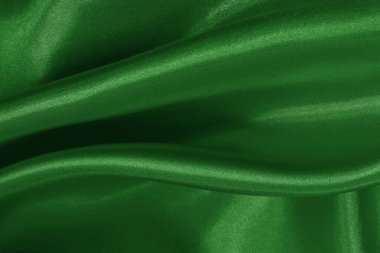 Arkaplan ve tasarım için koyu yeşil kumaş dokusu, güzel buruşmuş ipek ya da keten deseni..