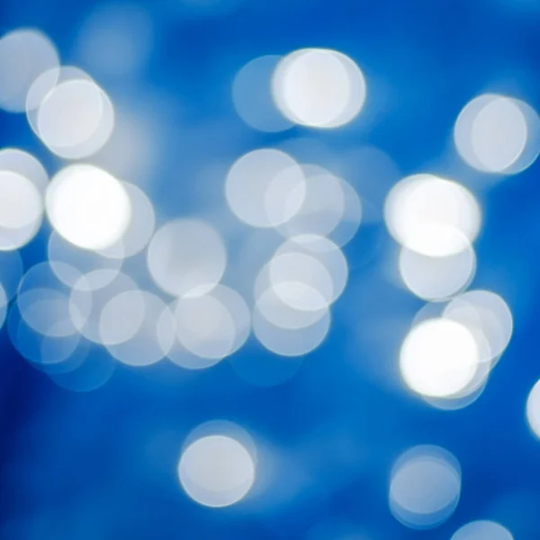 Blue bokeh abstract glow light. Energy flow defocused blurred motion abstract background