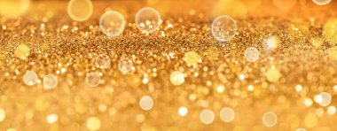 Altın Noel parçacıkları ışıkları. Parlak altın ışıklar arka plan.