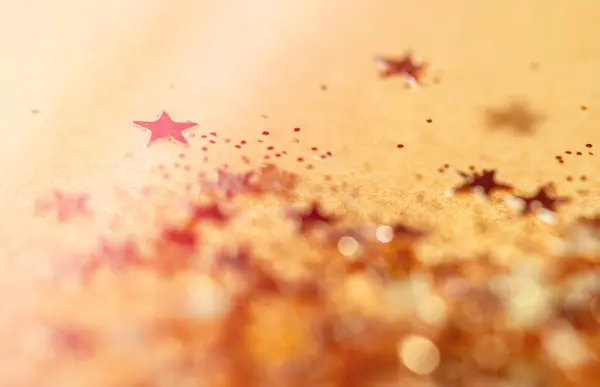 Golden Stars Over Gold Background. Gold Stars With Some Out Of Focus
