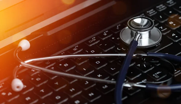 Stethoscope on a Laptop Keyboard. Global Medical Technology Diagnostic Concept.
