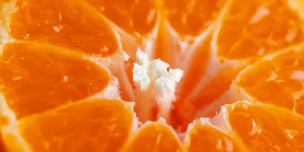 Tangerine slices close-up. Orange food of ripe clementines