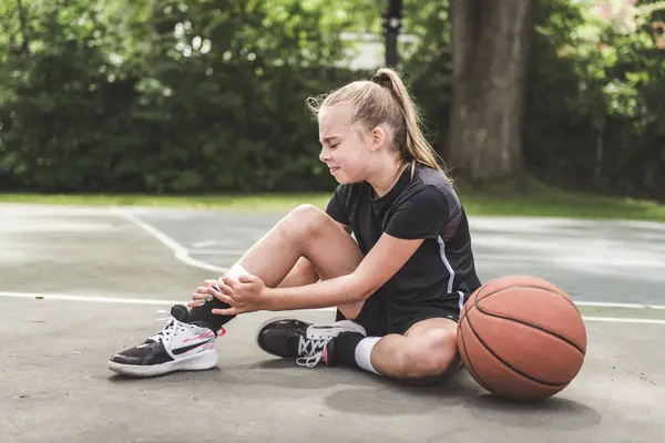 stock image A girl with basketball on court on summer season