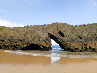 Rock formation in San Antolin beach, Spain. Spanish landscape clipart