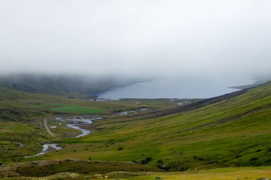 Mjoifjordur rural landscape, east Iceland. Icelandic view clipart