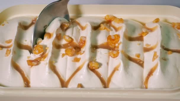 Scooping Caramel Ice Cream Spoon — Video