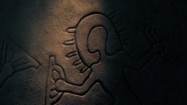 Ancient Aliens Carving Lit Up In Dusty Cave