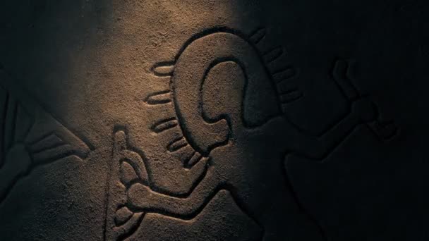 Ancient Aliens Carving Lit Dusty Cave — Stok video