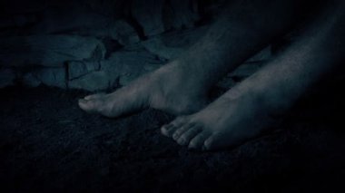 Legs Of Prisoner In Gloomy Cell