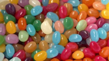 Candy Beans Poured Into Bowl Closeup 3 Shots
