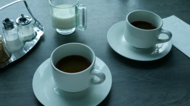 Heavy Vehicle Outside Shaking Cups On Table
