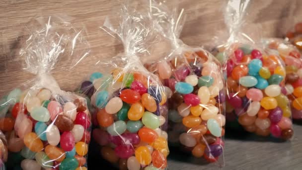 Passing Packs Candy Beans — Stockvideo