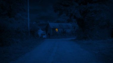 Work Shed With Light On In The Countryside