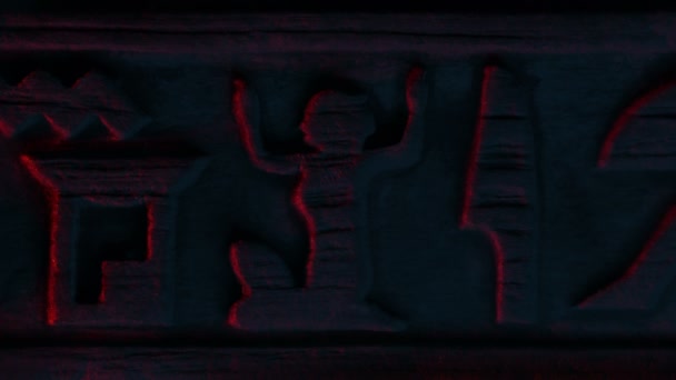Man Figure Lit Wall Hieroglyphs — Vídeo de Stock