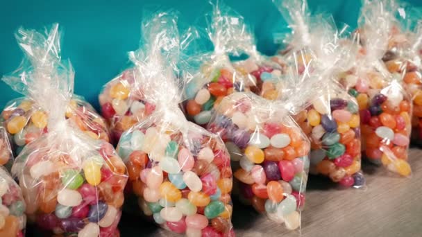 Man Picks Packet Jelly Beans Store — Stock Video