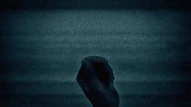 Hand With Burning Skull Appears In TV Static