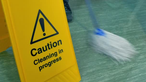 Person Mops Floor Safety Sign Shots — Stock Video