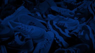 Sports Shoes Pile In Dark Room