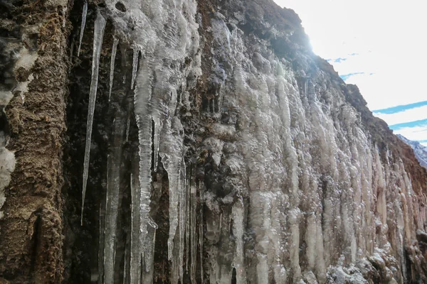 Frozen water of the springs in the Himalayan India.. Freezing is a phase transition where a liquid turns into a solid when its temperature is lowered below its freezing point.