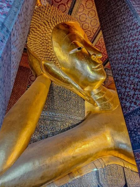 Big golden reclining buddha in the Wat Phra Chetuphon, Wat Pho temple, Bangkok, Thailand