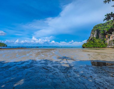 A panoramic view of Railay East beach during low tide in Krabi province, Thailand