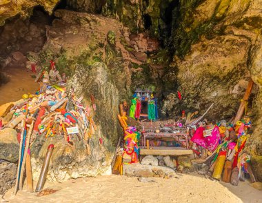 Phra Nang Cave Shrine Princess Cave with many wooden penis inside in Railay beach, Krabi district, Thailand clipart