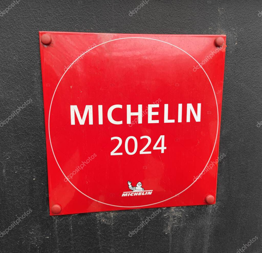 Riga, Latvia - 09 03 2024. Michelin 2024 Guide plate sign on a building with a good and fancy restaurant exterior wall.