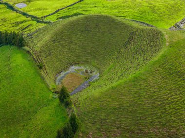 Scenic landscape with volcanic crater in Sao Miguel Island, Azores, Portugal. Aerial drone view of panoramic Acores islands clipart