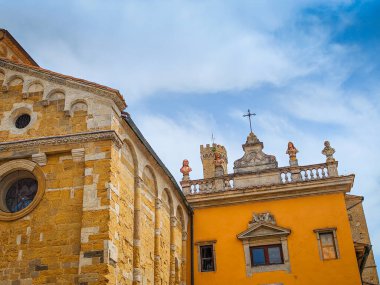 Volterra, Tuscany. Street view of Volterra - medieval Tuscan town located on a hill with old town, old houses, and towers in Italy clipart