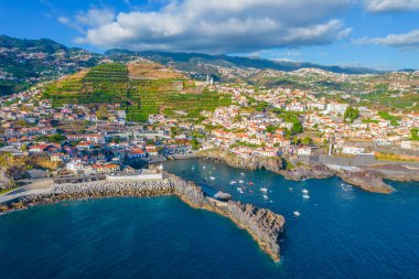 Aerial drone view of Camara de Lobos village panorama near to Funchal, Madeira. Small fisherman village with many small boats in a bay