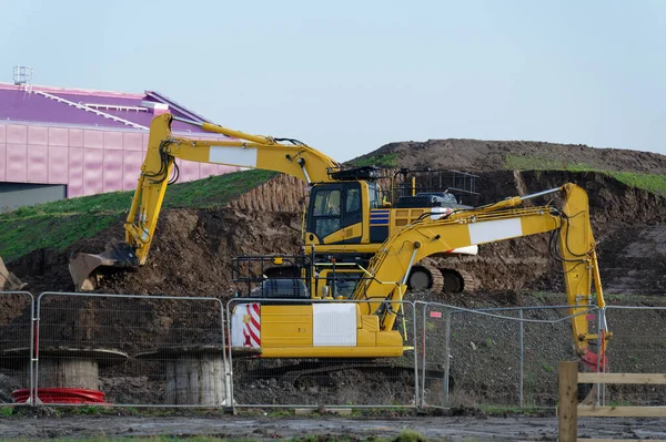 Escavador Local Construção Amarelo Durante Escavação Local Construção Reino Unido — Fotografia de Stock