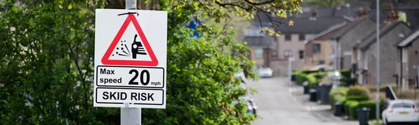 Skid risk road speed limit safety sign UK