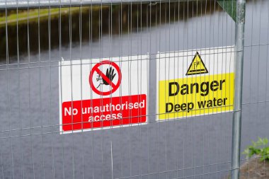 Deep water danger sign at rivers edge UK clipart