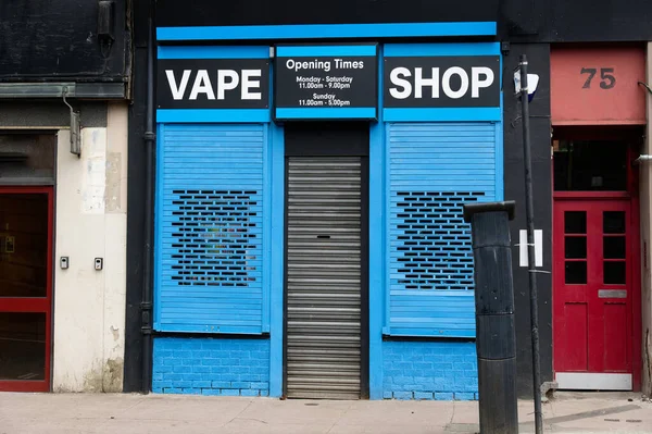 stock image Vape shop selling e-cigeretts and vape kits on the high street. High quality photo