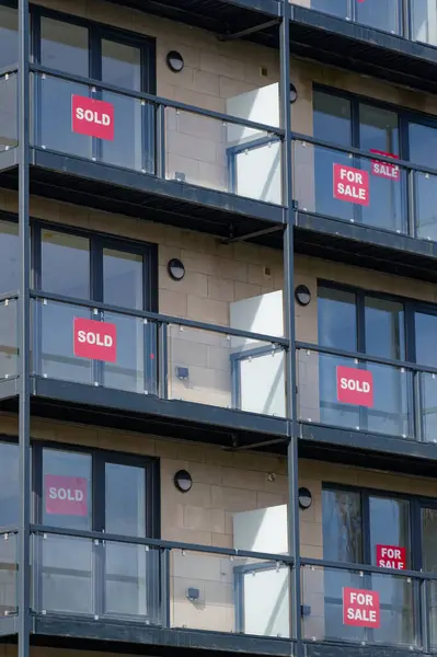 Sold and for sale signs on new property available on the market UK