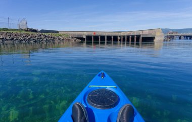 Old derelict wooden jetty pier in sea at Inverkip power station UK