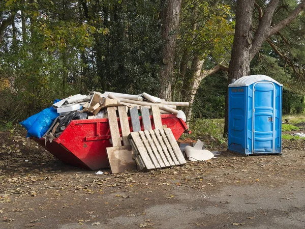 Rubbish and garbage in skip for disposal at dump site UK