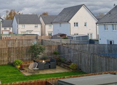 Garden plant display and outdoor furniture during summer UK