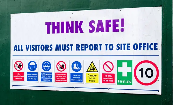 Construction site health and safety sign on fence UK