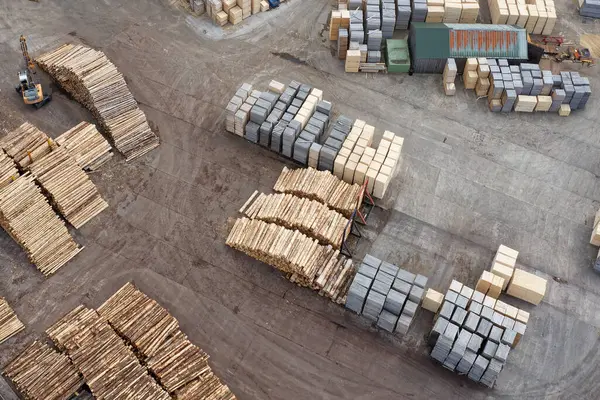 stock image Sawmill with chopped wood logs stacked and machinery UK