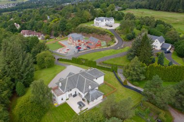 Luxury houses viewed from above in Kilmacolm UK clipart